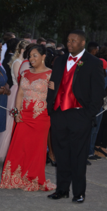 Alexis Davis, left, is escorted by Dion Graham. (Photo by Jean Kunath)